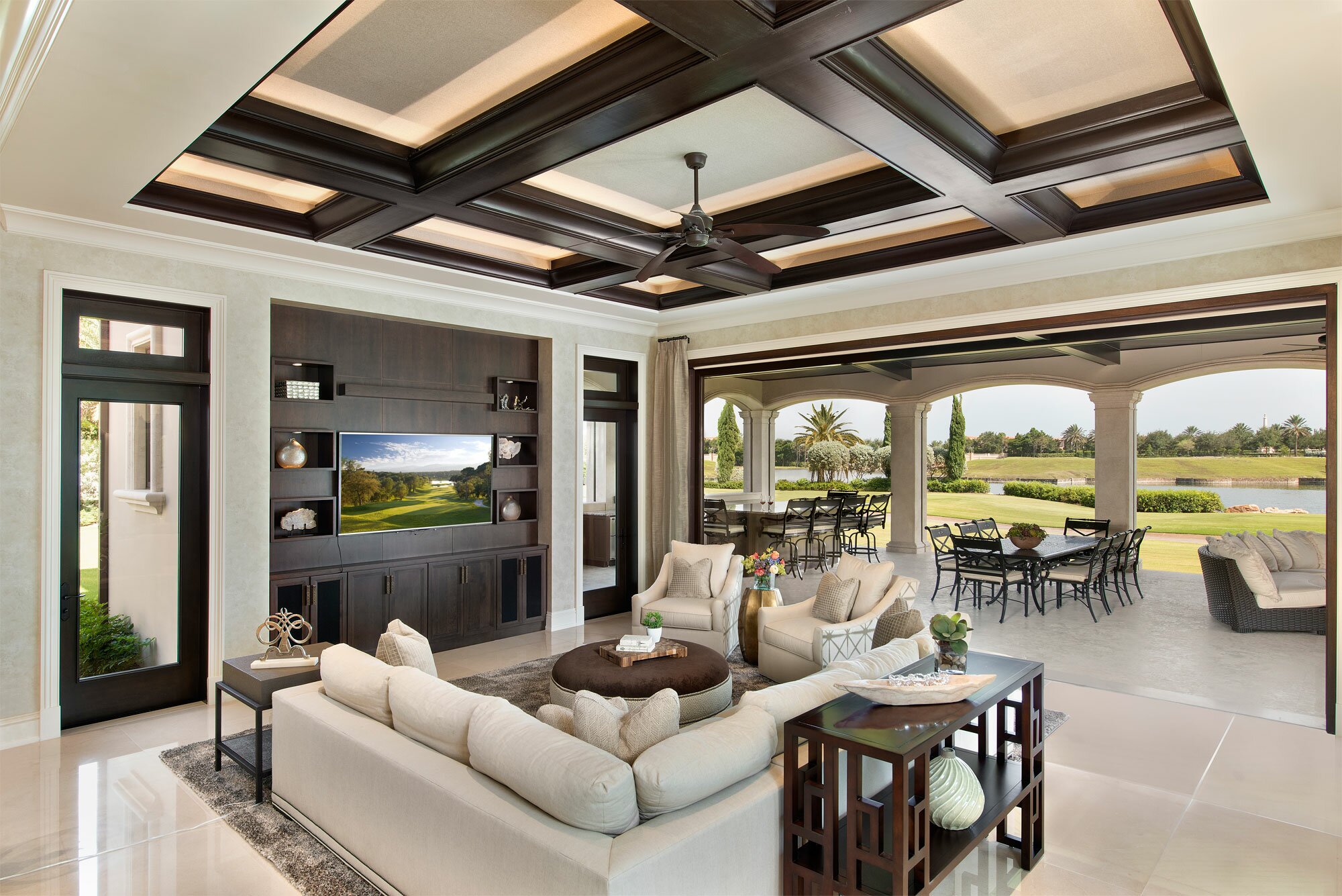 Luxurious living room with elegant furniture and scenic outdoor views.