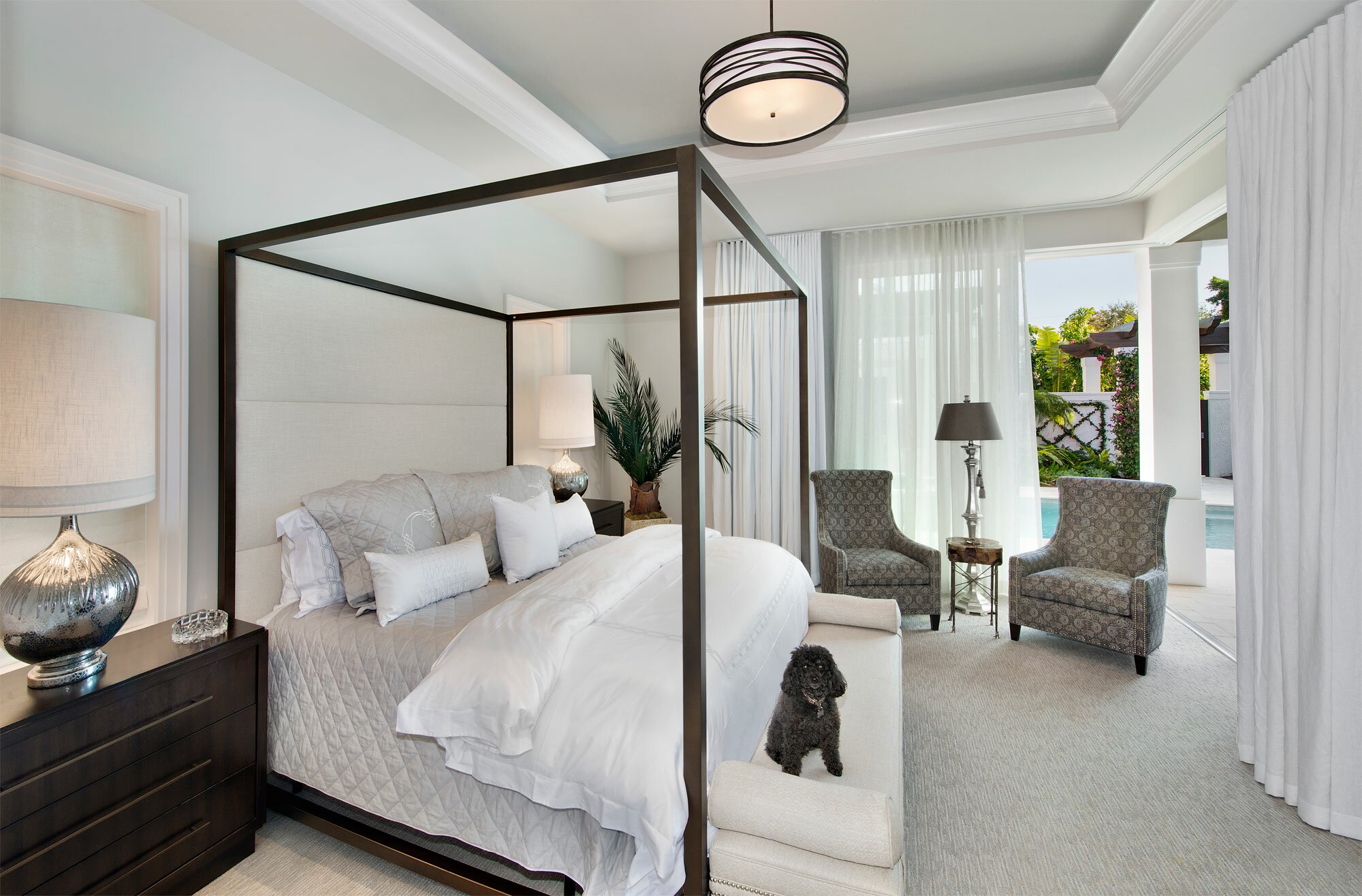 Elegant bedroom with a four-poster bed and calming neutral tones.
